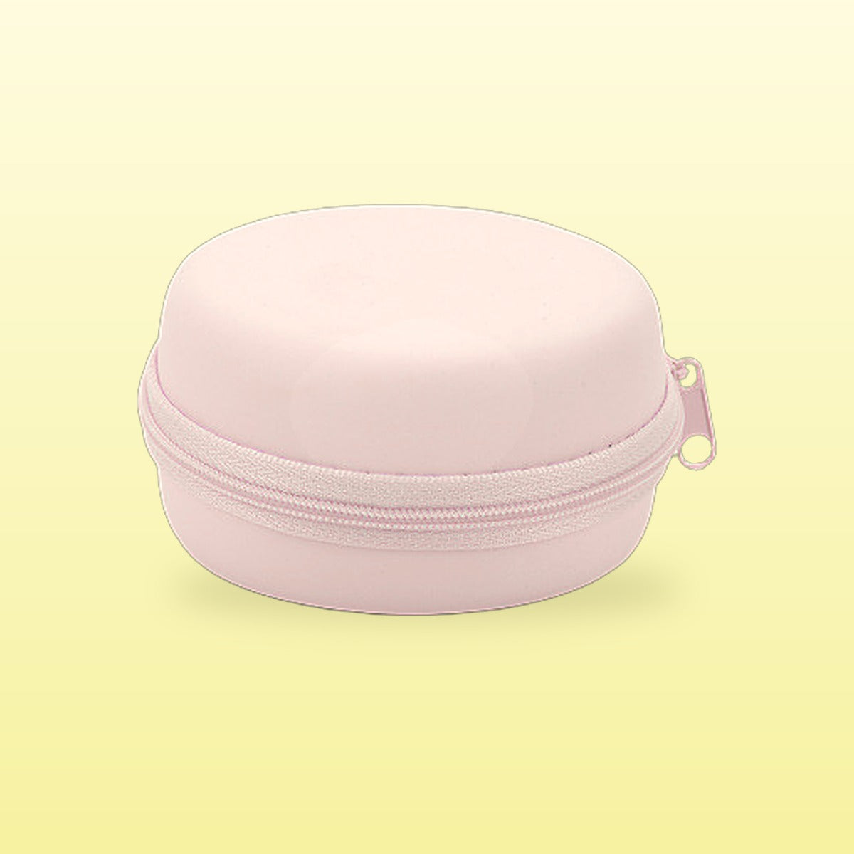 Rose pink macaron travel jewellery case on a butter yellow background