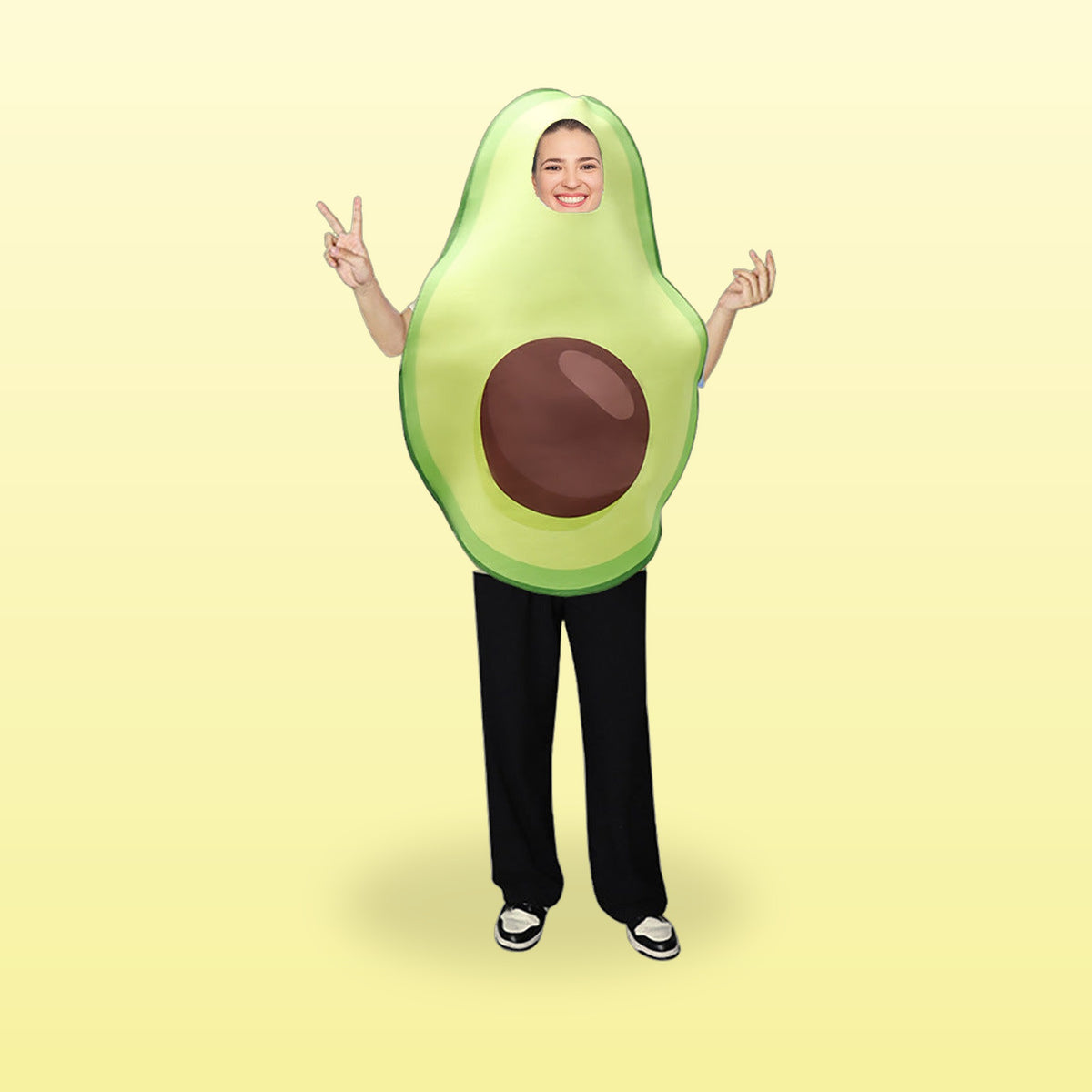 Avocado food costume for adults, a halved avocado with a big brown pip, on a butter yellow background