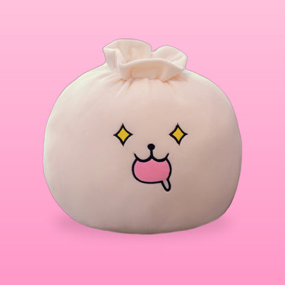 Cream bao bun plush pillow with sparkly eyes and a drooling pink mouth on a pink background