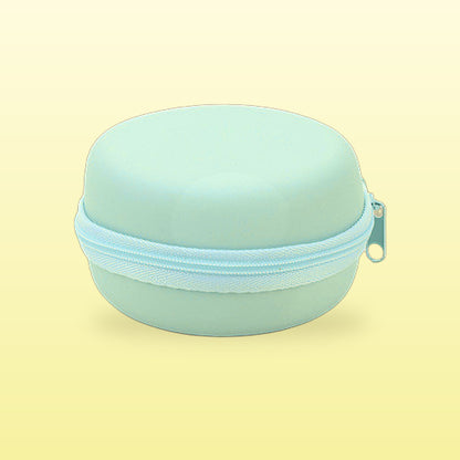 Mint macaron travel jewellery case, closed, on a butter yellow background