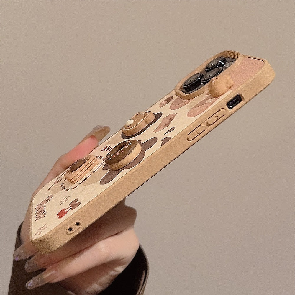 Side view of the iPhone case showing the raised 3D bear, donut and biscuit details