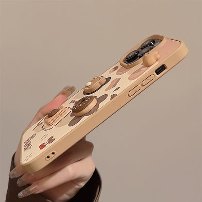 Side view of the iPhone case showing the raised 3D bear, donut and biscuit details