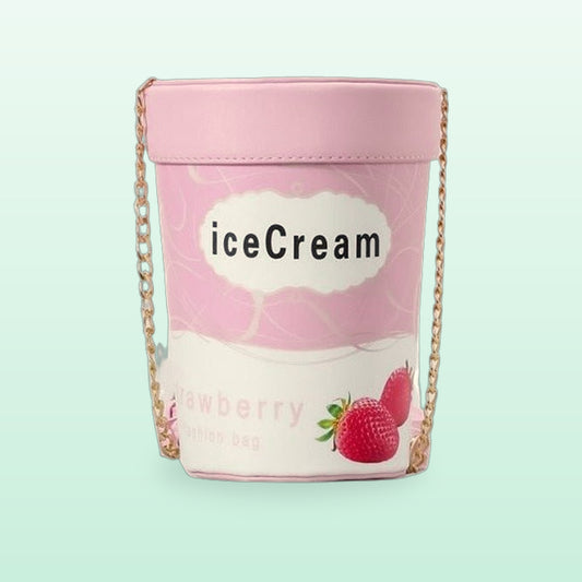 Pink strawberry ice cream tub crossbody bag with a gold chain strap on a mint background