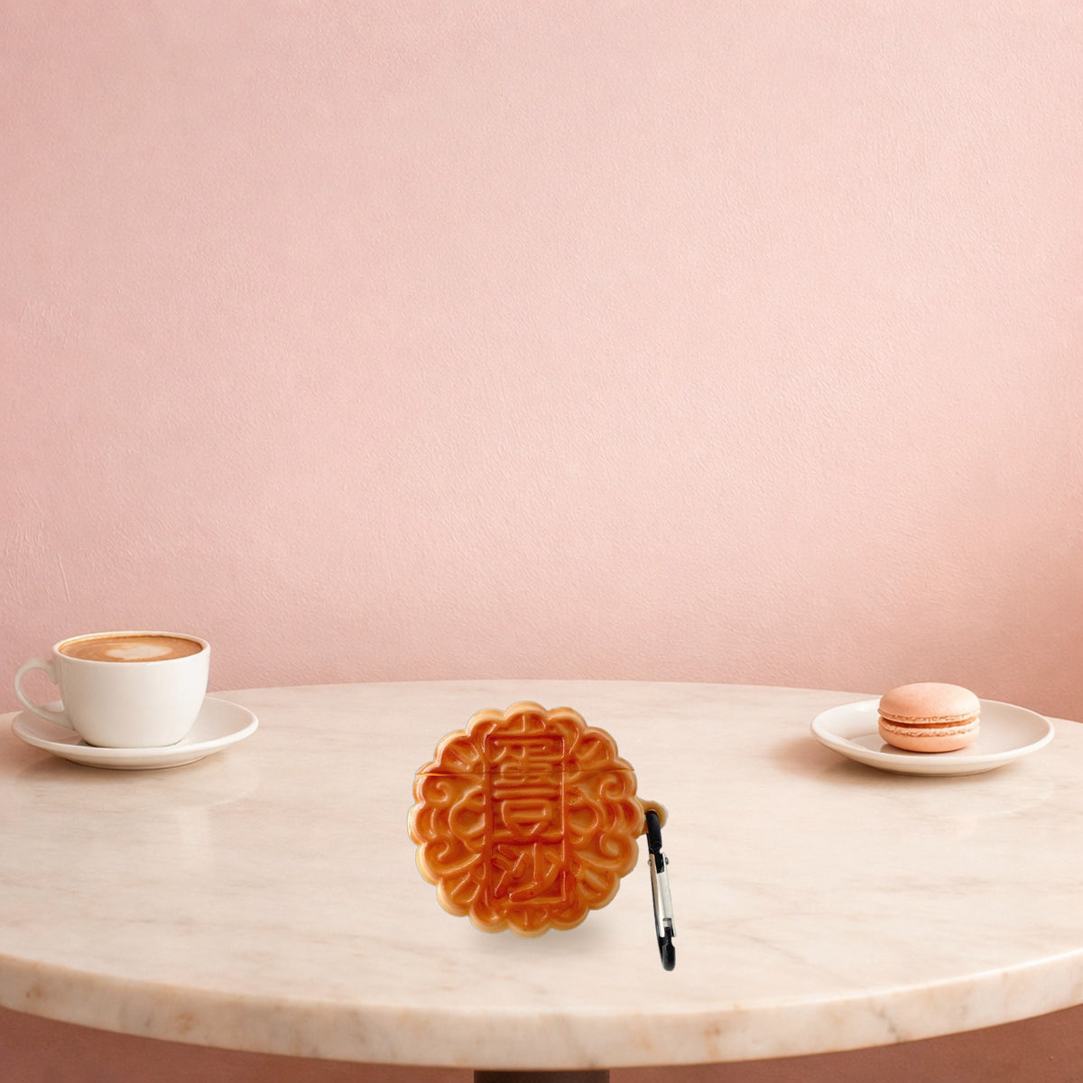 Mooncake silicone AirPods case standing on a pink cafe table