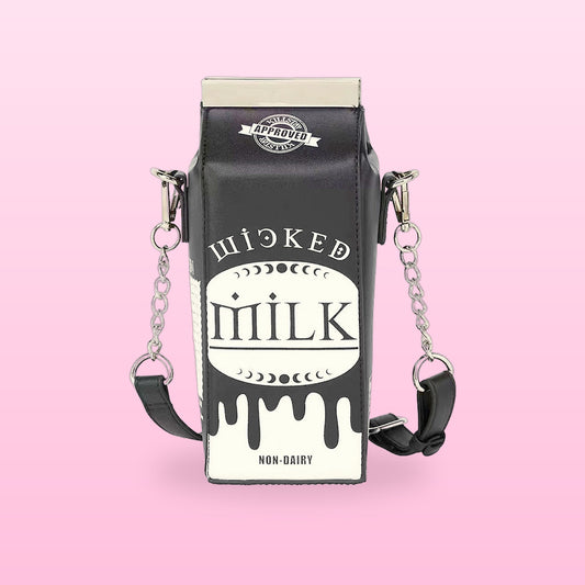 Black milk carton crossbody bag with a white drip print and chain strap, on a pink background