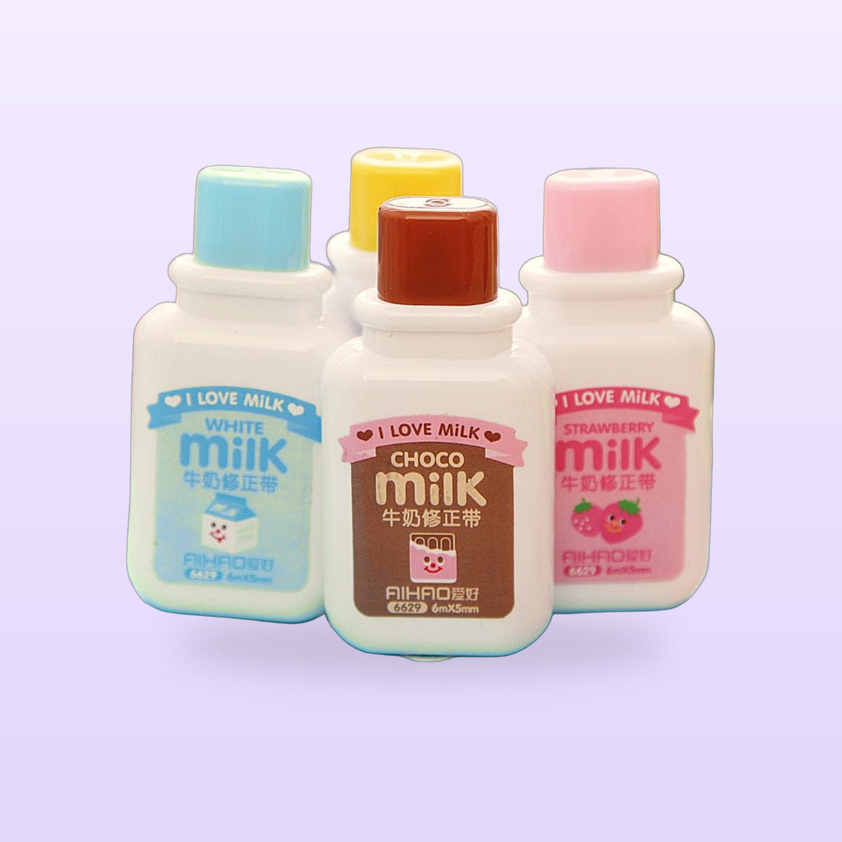 Milk bottle correction tapes in white, choco, banana and strawberry, on a lilac background