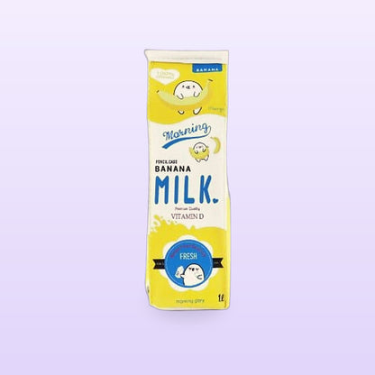 Yellow banana milk carton pencil case standing upright, on a lilac background