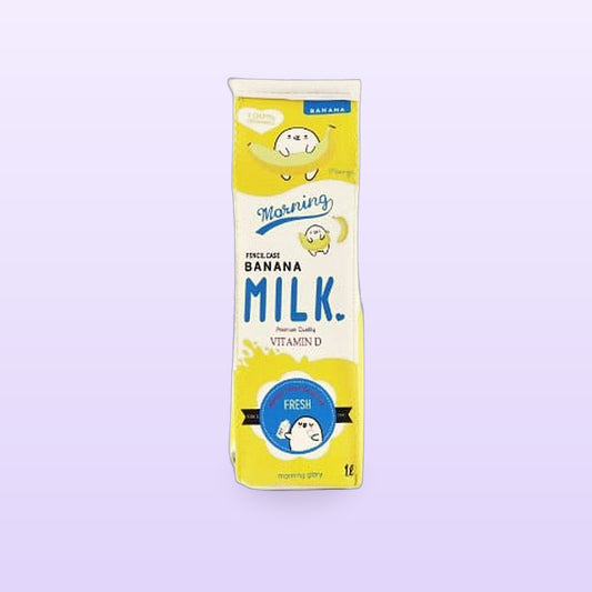 Yellow banana milk carton pencil case standing upright, on a lilac background