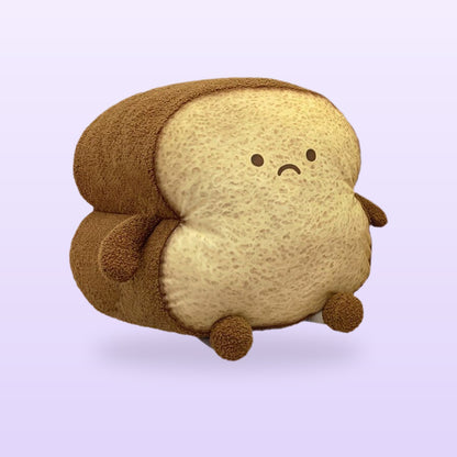 Sad toasted loaf plush cushion, size XL, on a soft lilac background