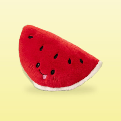 Watermelon slice plush with a smiling face and black seeds, on a butter yellow background