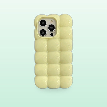 Bubble block iPhone case in light green with puffy glossy squares, back view on a mint background