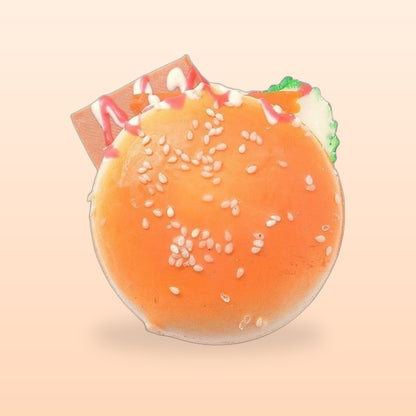 Burger slow rise bread squishy on a soft peach background