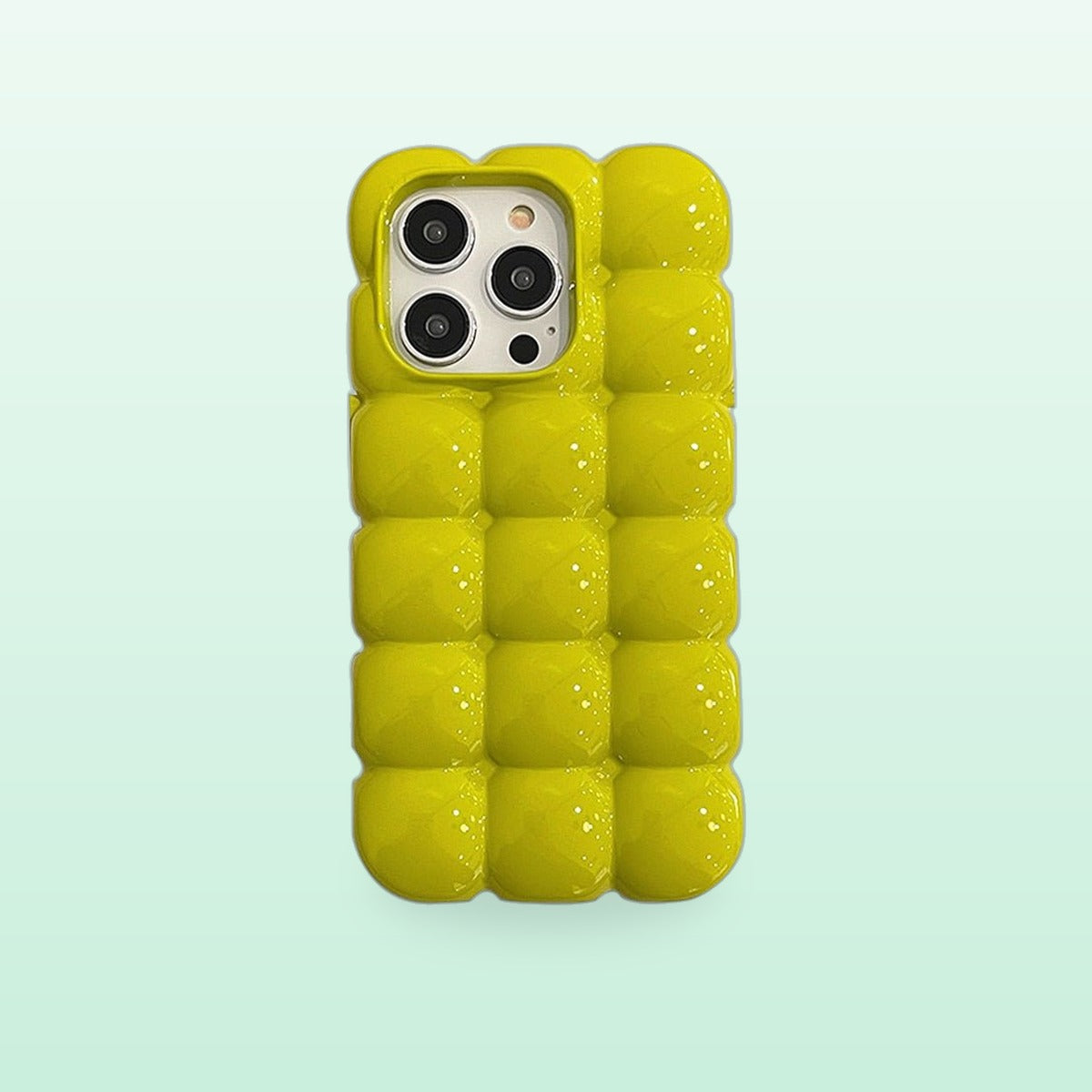 Bubble block iPhone case in lime green with puffy glossy squares, back view on a mint background