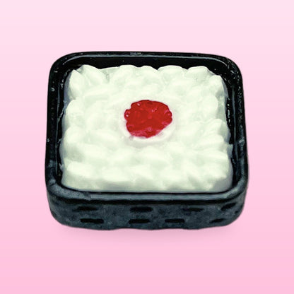 Rice box miniature food fridge magnet in a black box with a red centre, on a pink background