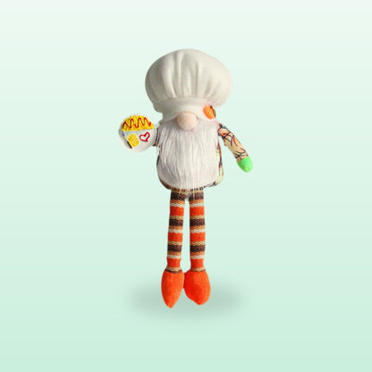 Long leg chef plush gnome with a white hat, striped orange legs and a plate, on a mint background