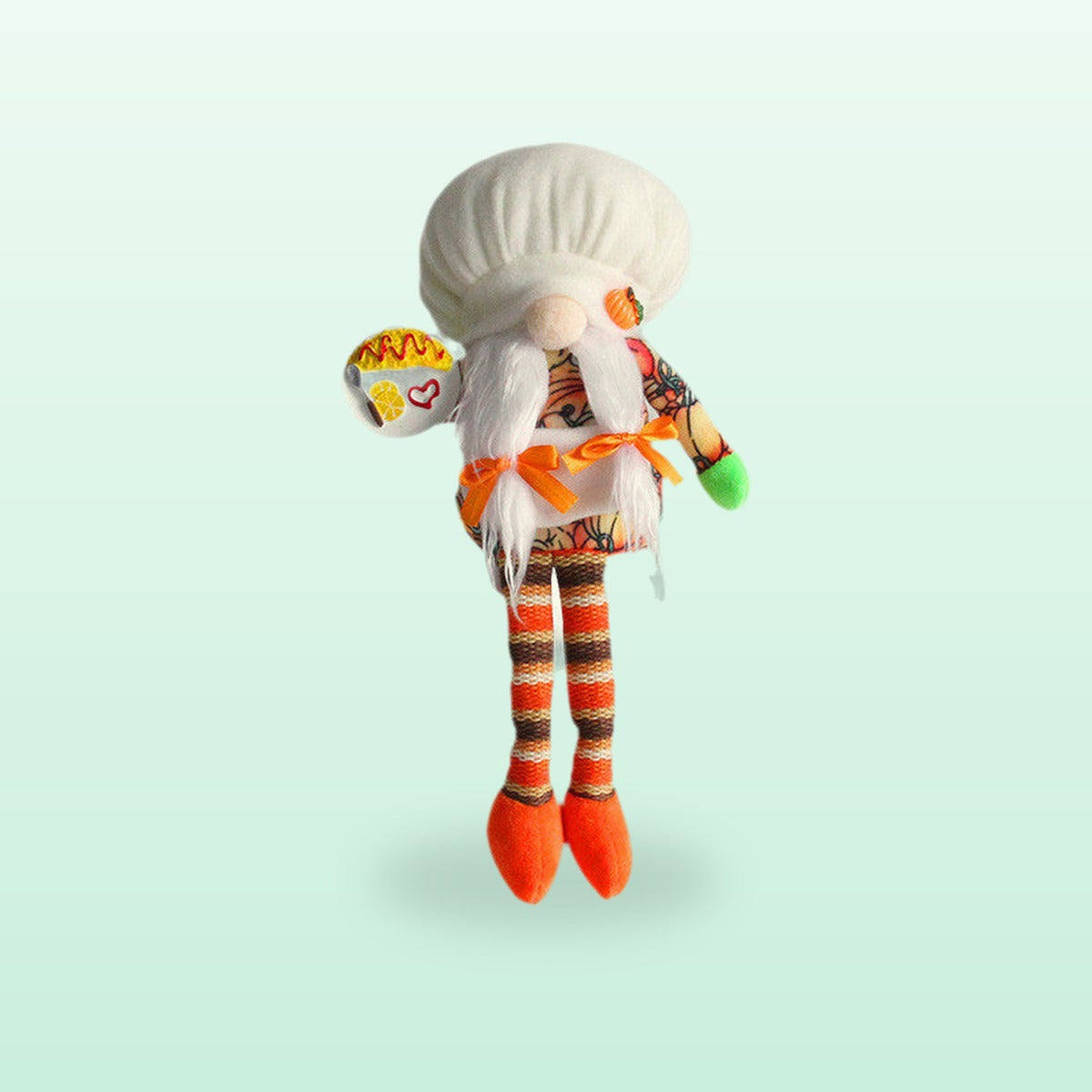 Long leg chef with plaits plush gnome with a white hat and striped orange legs, on a mint background