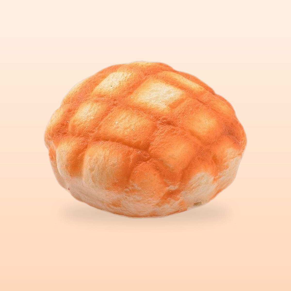 Melon pan bun slow rise bread squishy, on a soft peach background