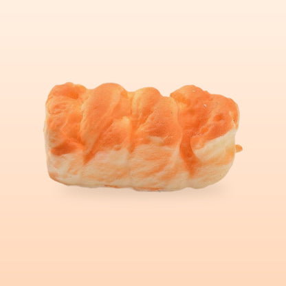 Flaky pastry slow rise bread squishy, on a soft peach background