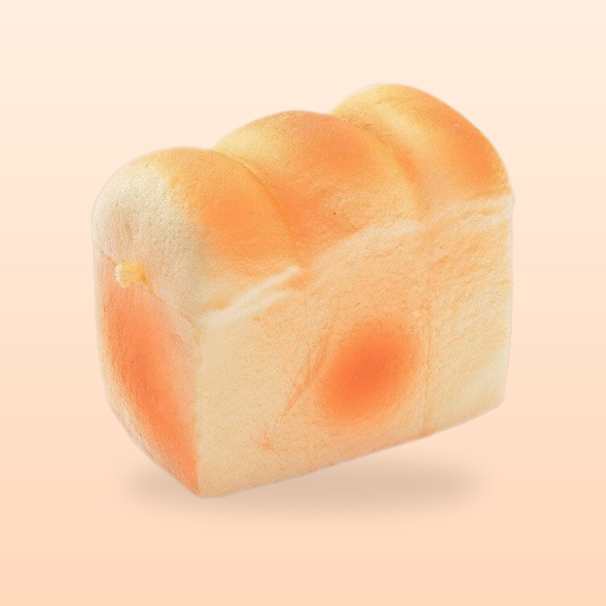 Toast loaf slow rise bread squishy, on a soft peach background