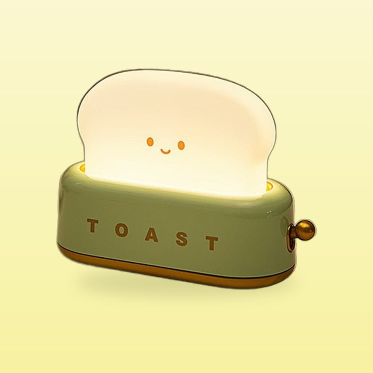 Green toast night light glowing with a smiling face, on a butter yellow background