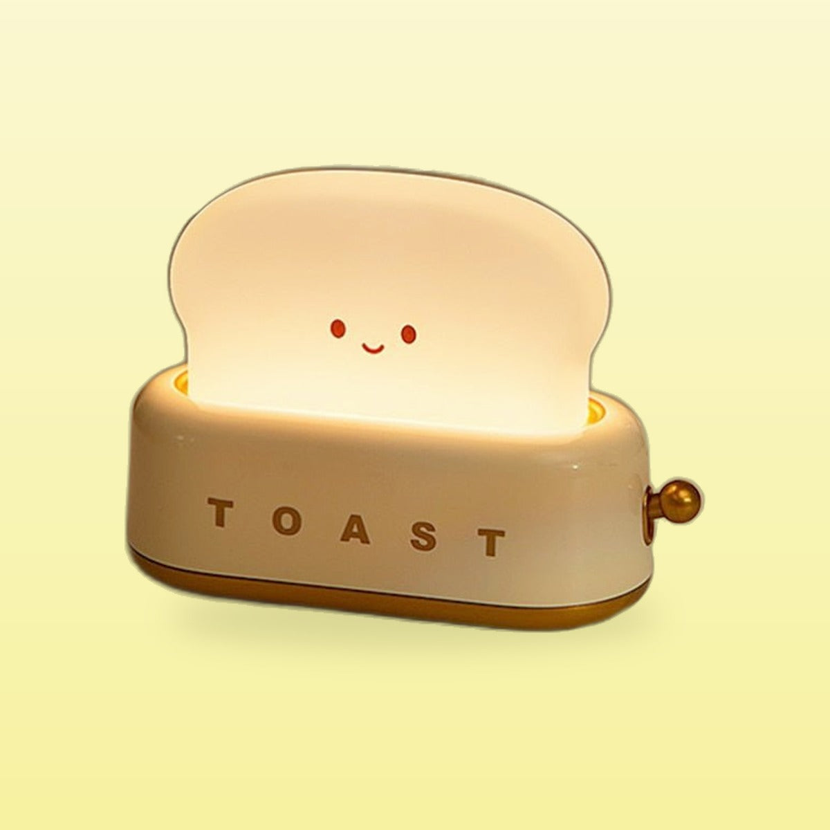 Cream yellow toast night light glowing with a smiling face, on a butter yellow background