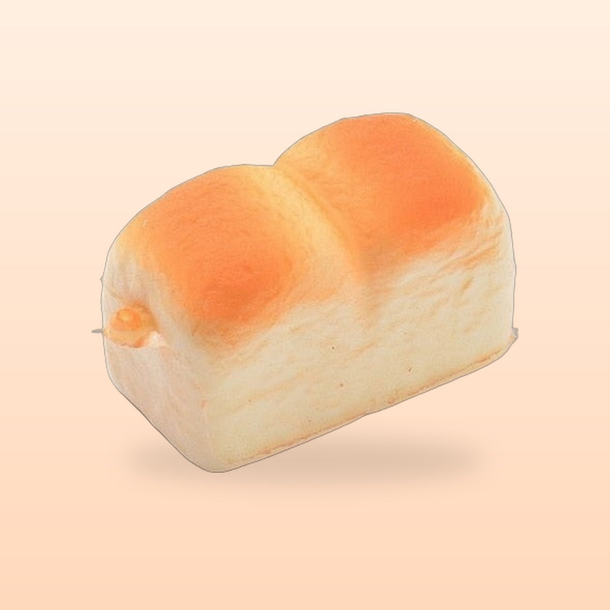 Mini toast slow rise bread squishy on a soft peach background