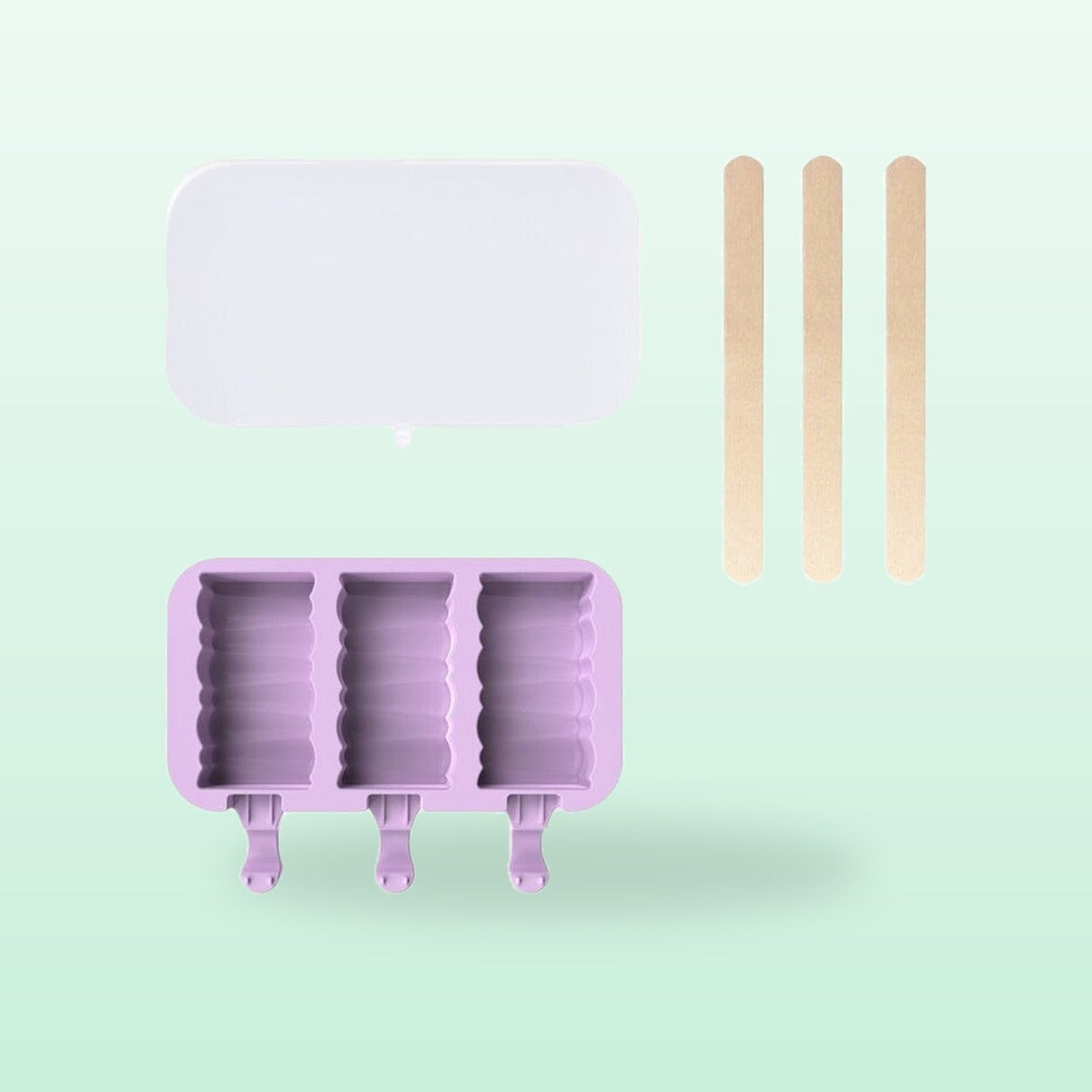 Building blocks silicone ice lolly mould, lilac, with lid and sticks, on a mint green background