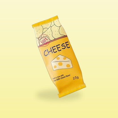 Cheesy snack packet pencil case in yellow with a cheese wedge, on a butter yellow background