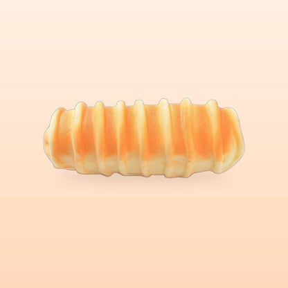 Ridged roll slow rise bread squishy on a soft peach background