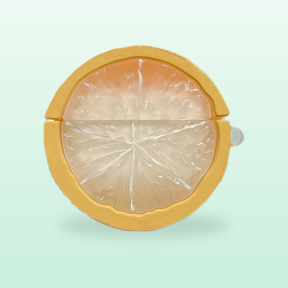 Yellow lemon slice silicone AirPods case, front view, on a mint background