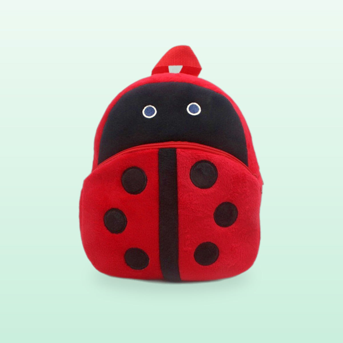 Ladybird plush mini backpack in red with black spots, on a mint green background