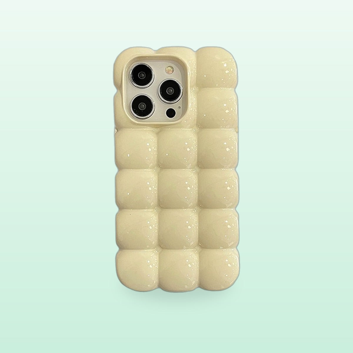 Bubble block iPhone case in creamy white with puffy glossy squares, back view on a mint background