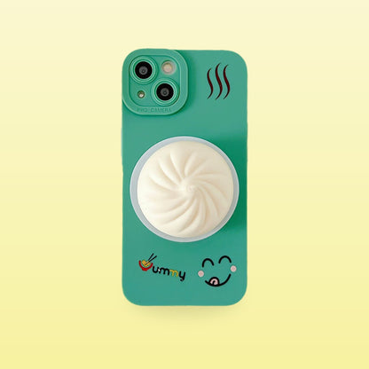 Green squishy bao bun iPhone case with steam print, on a butter yellow background