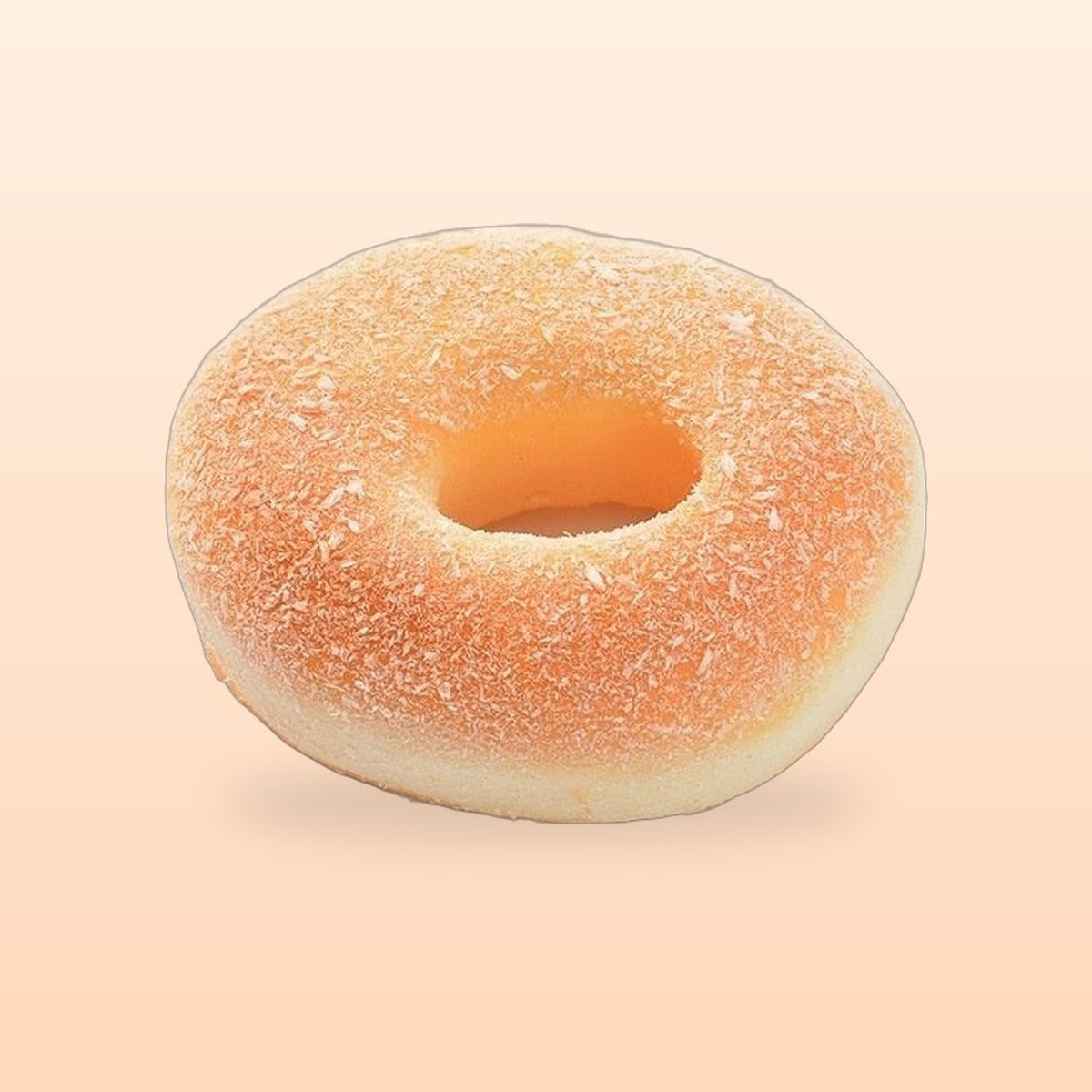 Sugar donut slow rise bread squishy on a soft peach background