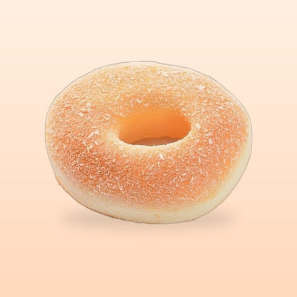 Sugar donut slow rise bread squishy on a soft peach background