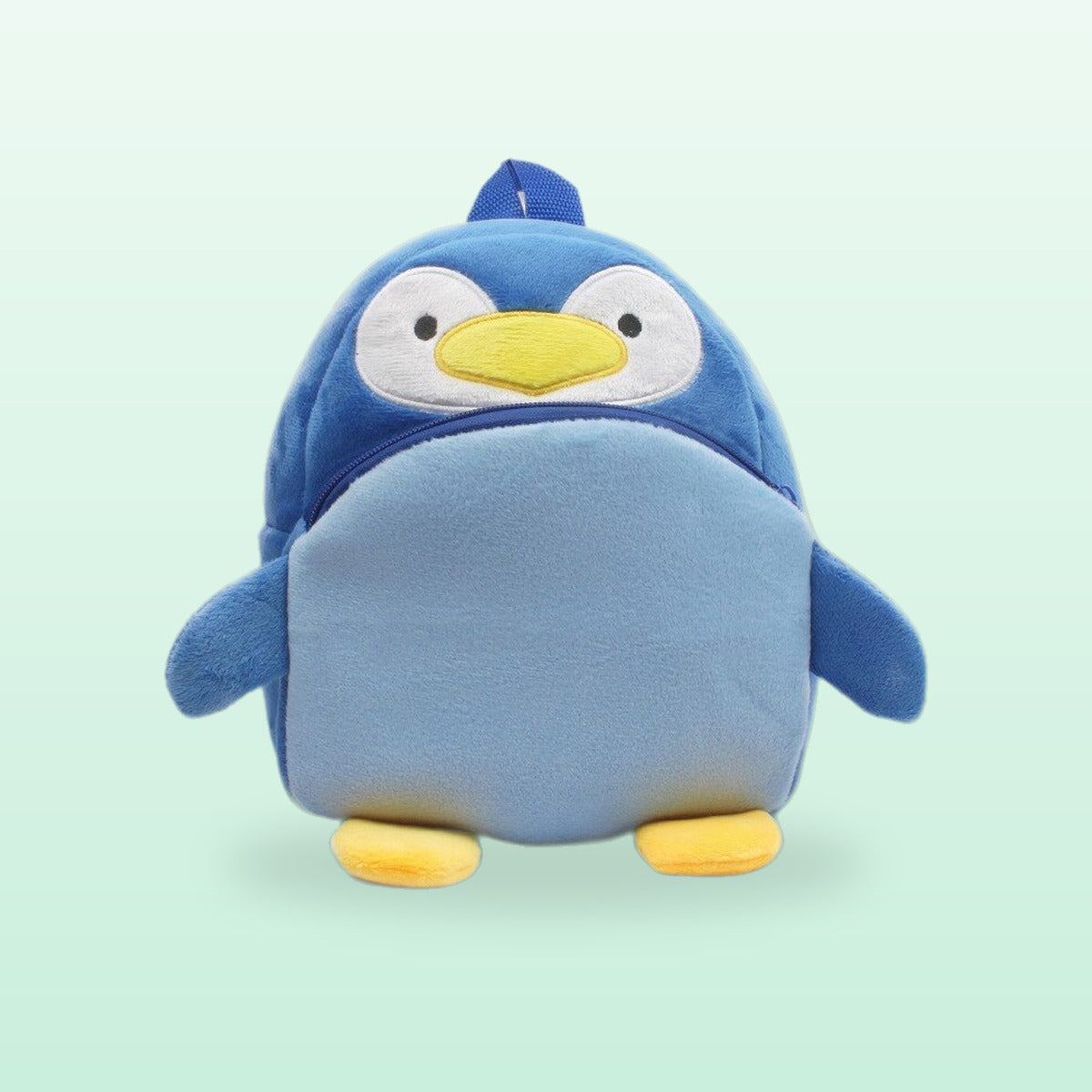 Penguin plush mini backpack in blue with a yellow beak and feet, on a mint green background