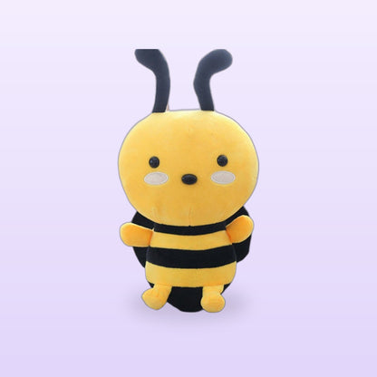 Yellow and black honeybee plush toy with antennae and white cheek patches, on a soft lilac background