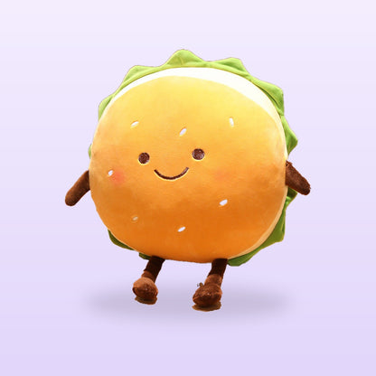 Smiley burger plush cushion with rosy cheeks and brown legs, on a soft lilac background