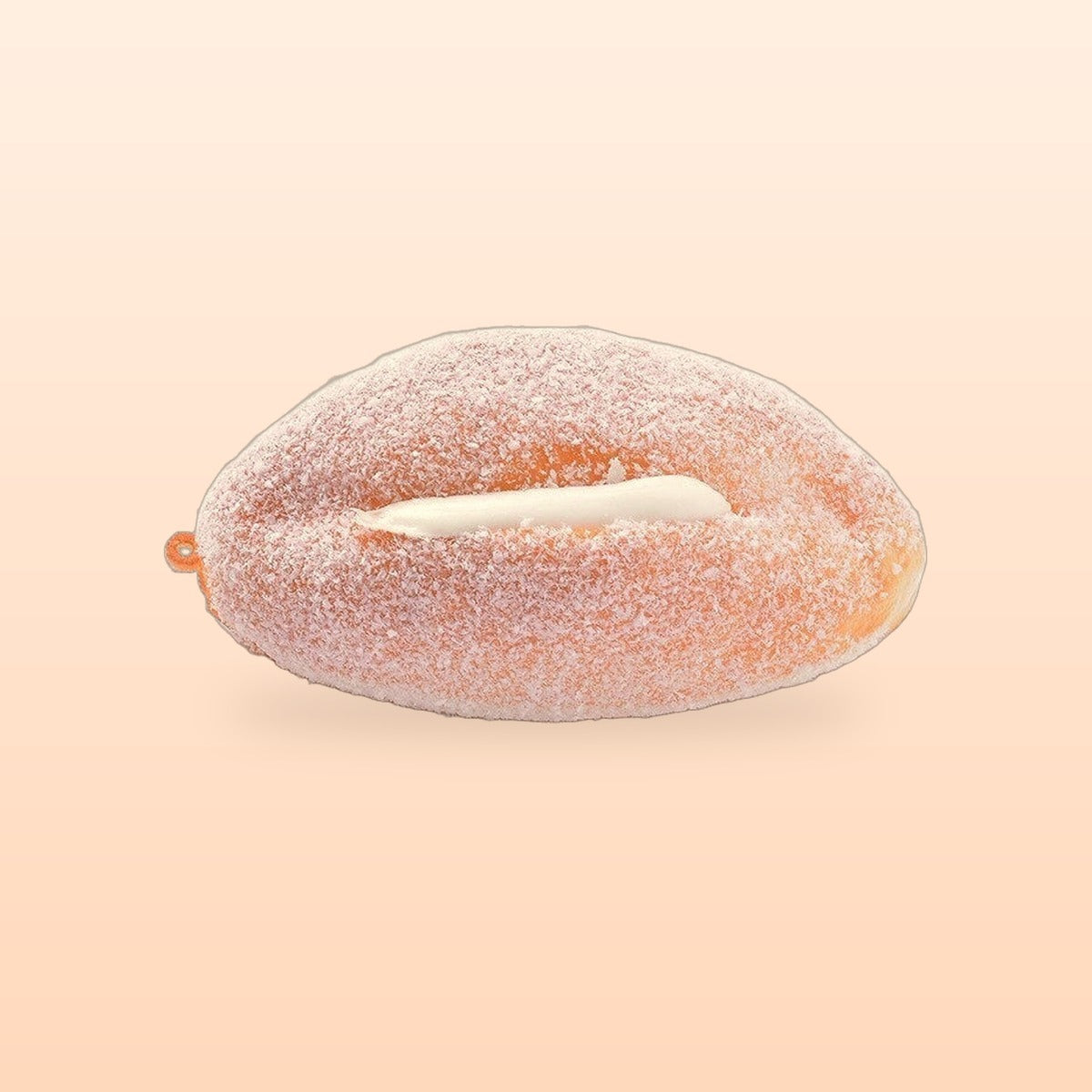 Cream roll slow rise bread squishy on a soft peach background