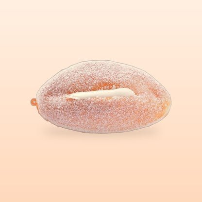 Cream roll slow rise bread squishy on a soft peach background