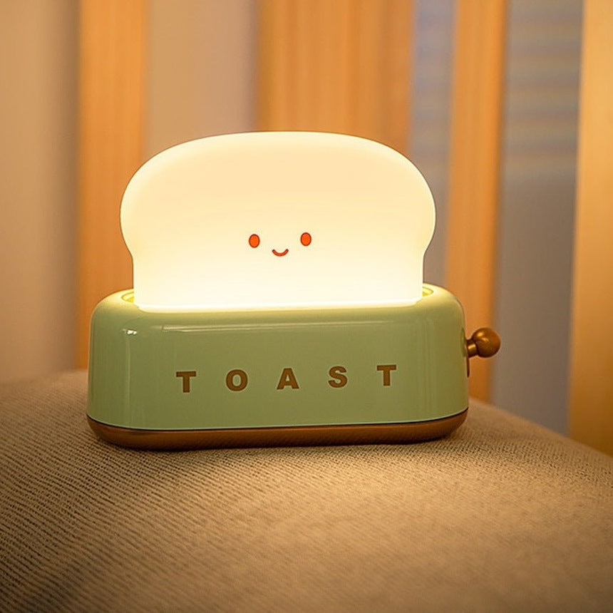 Green toast night light with battery life and USB C charging details