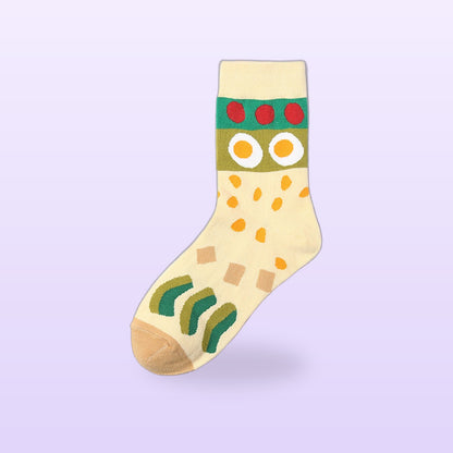 Cream cotton sock with fried eggs, tomatoes and a green band, on a soft lilac background