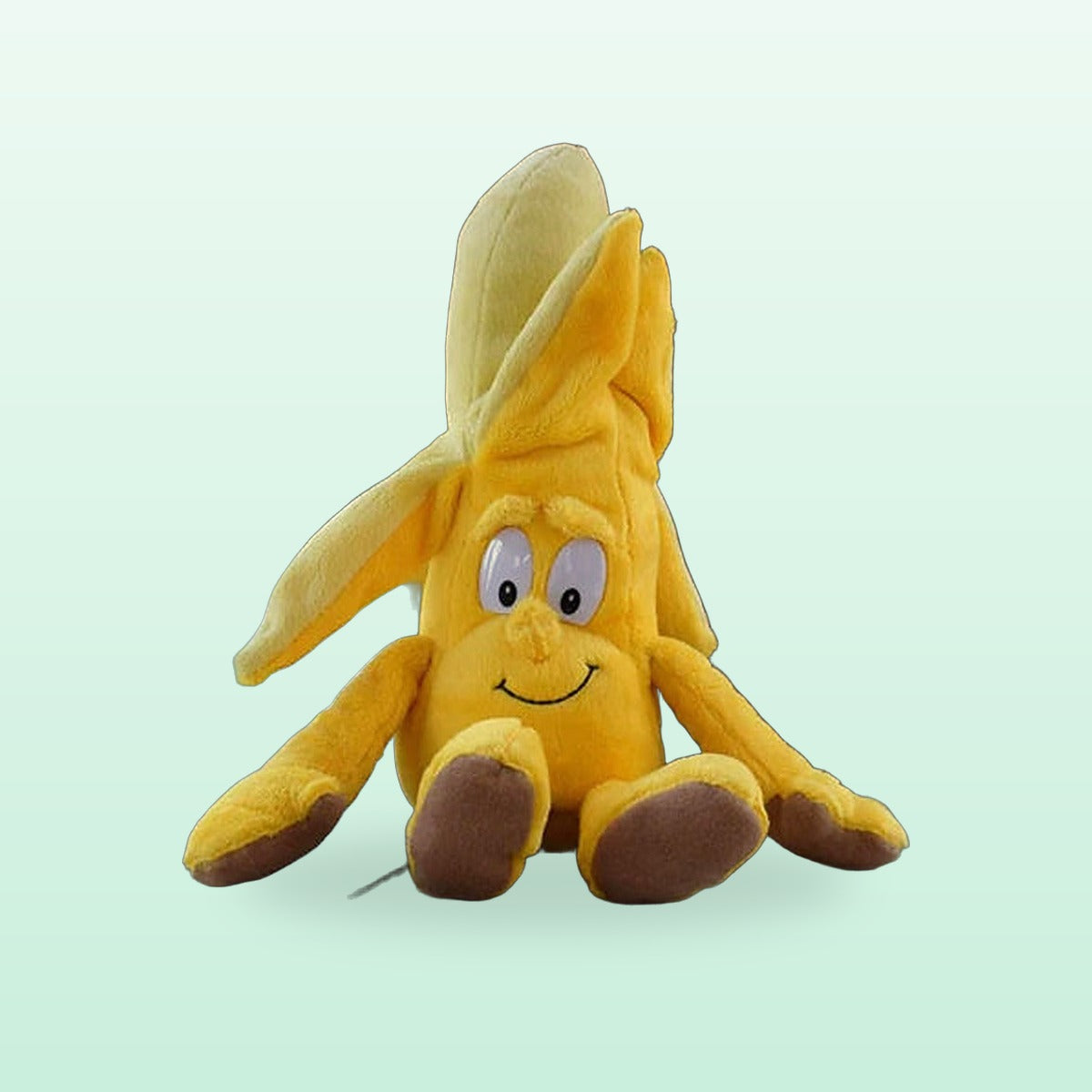 Fruit and veg buddies plush, Banana, sitting on a mint green background