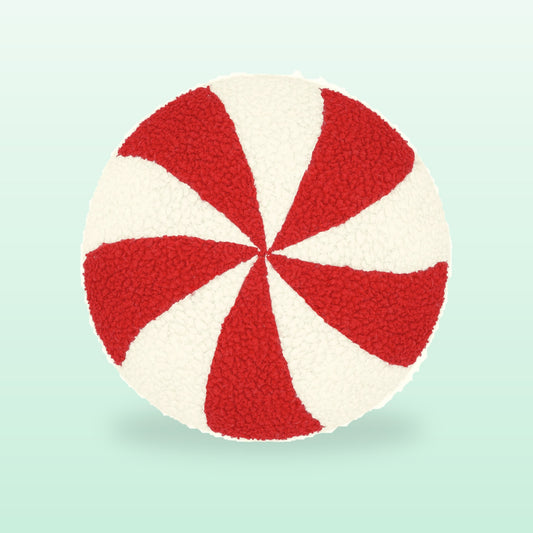 Peppermint swirl round plush cushion in red and white, on a soft mint background