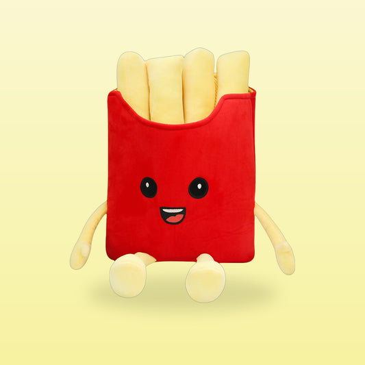 French fries plush pillow with a smiling face and dangly arms and legs, on a butter yellow background