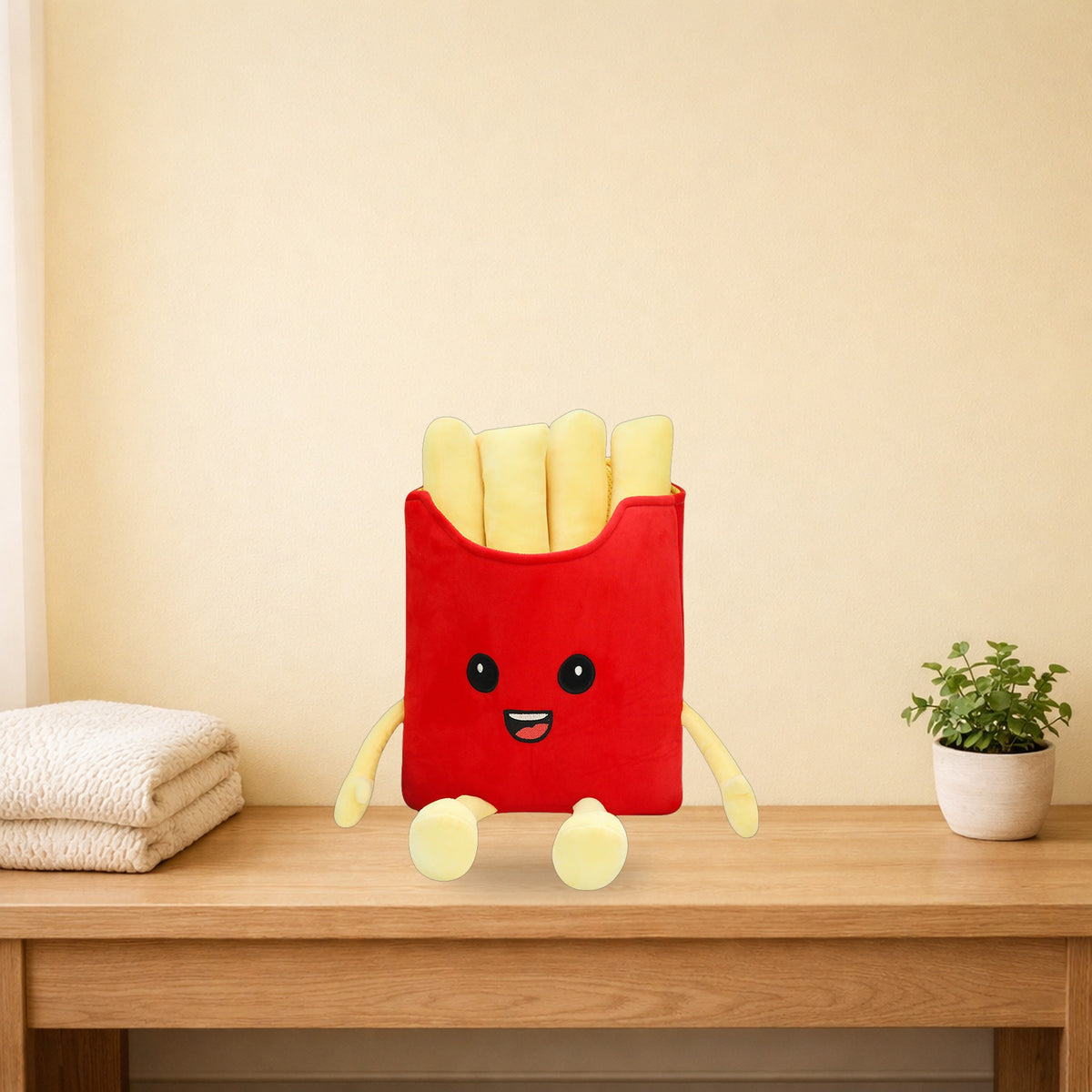 French fries plush pillow sitting on a light oak console table