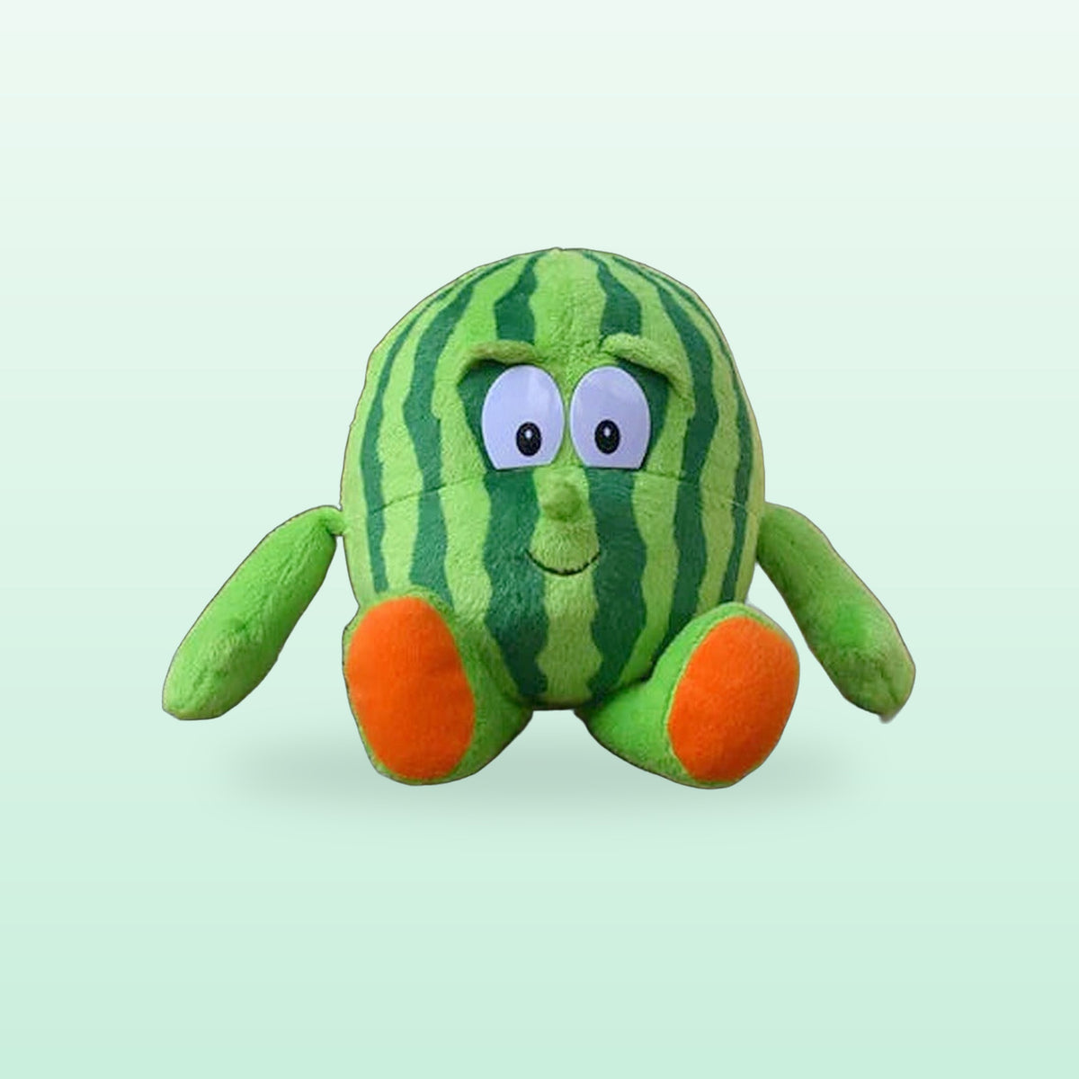 Watermelon fruit and veg buddies plush with orange feet, on a mint green background