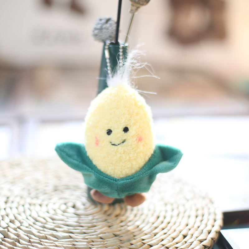 Real supplier photo: smiley plush corn charm, about 12 cm, one of the five veg in the kit