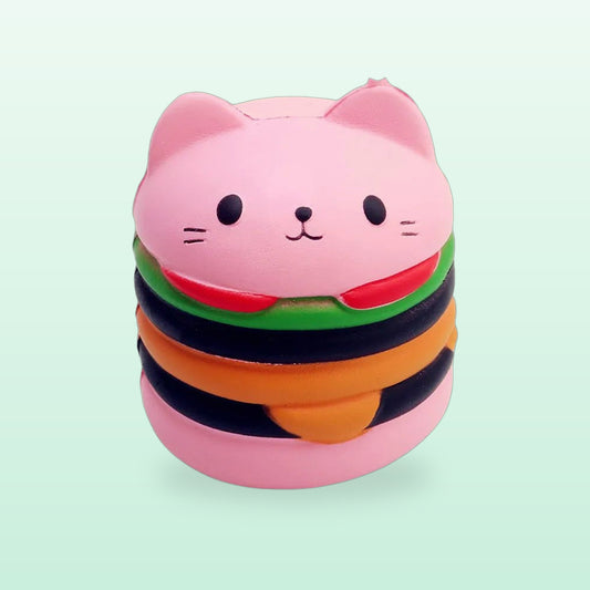 Pink cat burger squishy toy with cat ears and layered fillings, on a mint green background