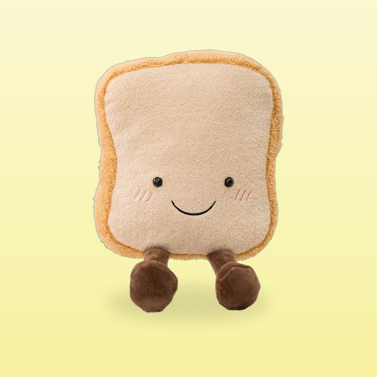 Smiling toast plush with rosy cheeks and little brown legs on a butter yellow background
